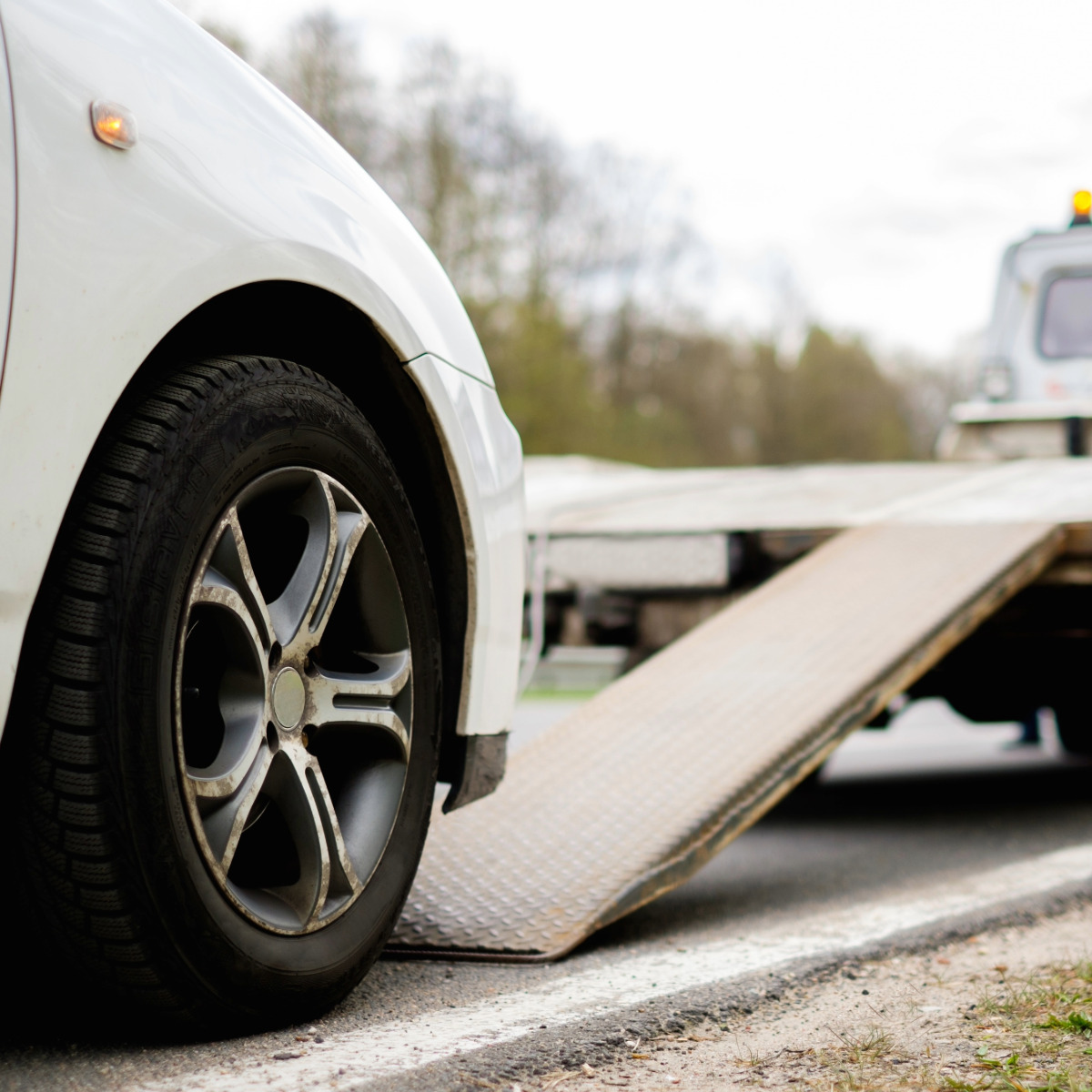 Long distance towing using a flatbed truck